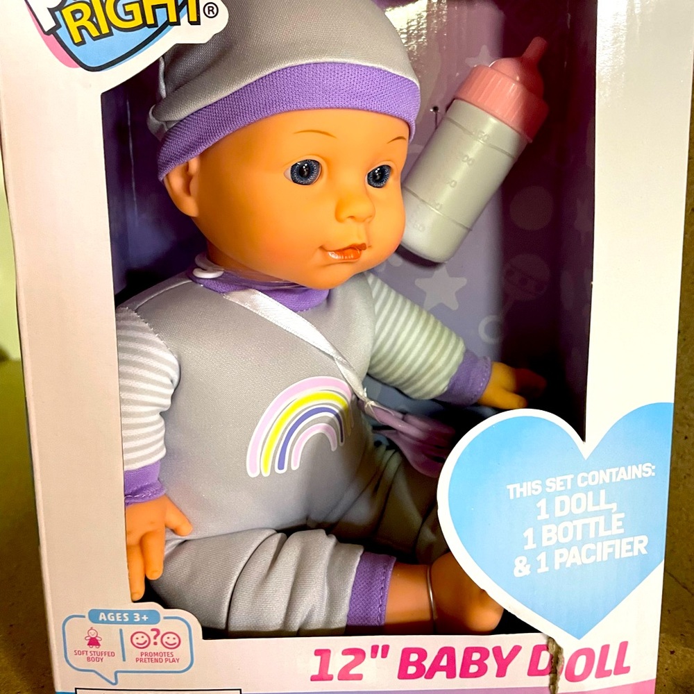 Baby doll with bottle and pacifier